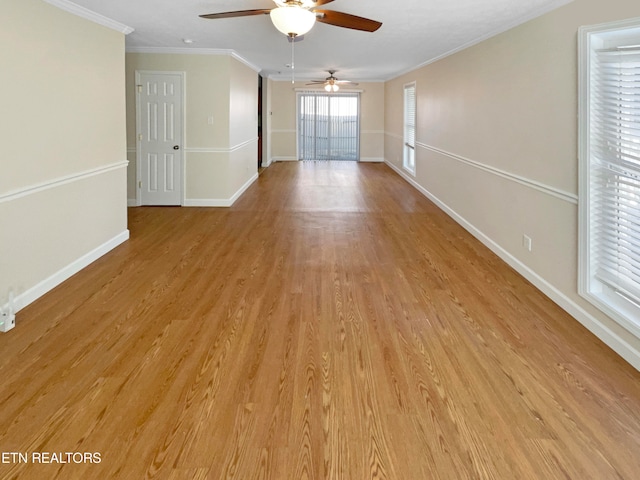 spare room featuring ceiling fan, ornamental molding, and light hardwood / wood-style floors