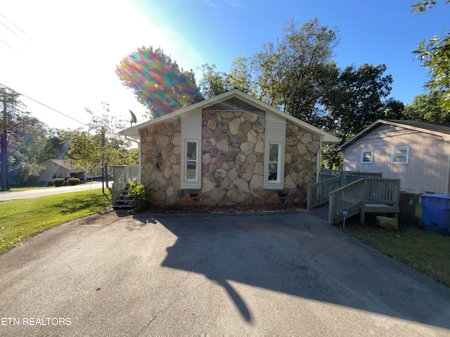 view of side of property with a yard