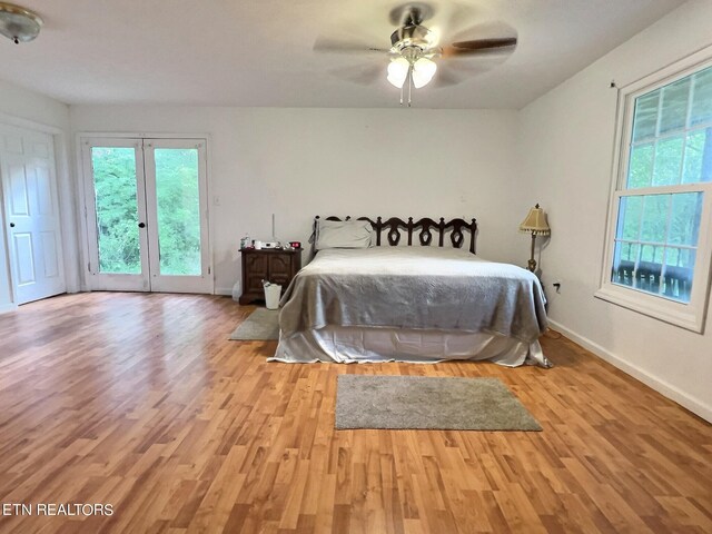 bedroom with ceiling fan, access to outside, and light hardwood / wood-style floors