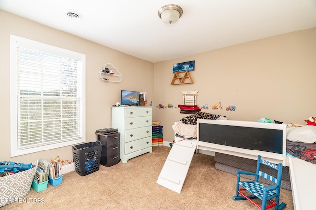 bedroom with carpet and visible vents
