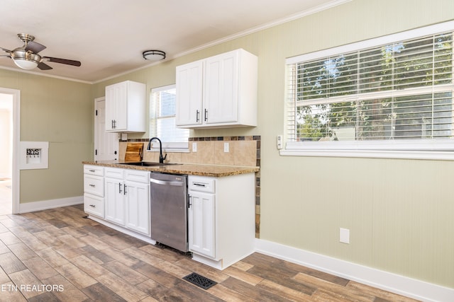 kitchen featuring dishwasher, light hardwood / wood-style floors, plenty of natural light, and sink