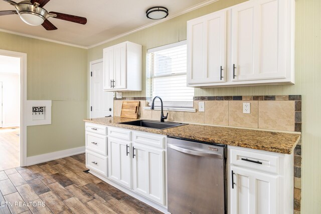 kitchen with white cabinetry, dark wood-type flooring, ceiling fan, dark stone counters, and stainless steel dishwasher