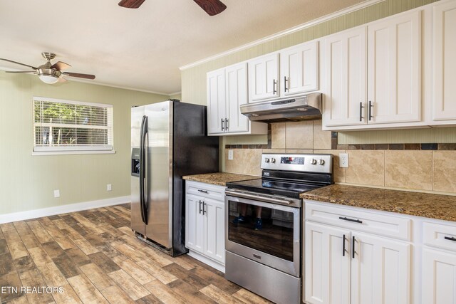 kitchen featuring ornamental molding, ceiling fan, stainless steel appliances, and white cabinets