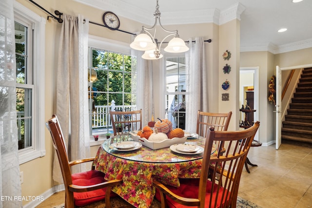 tiled dining space with crown molding and a notable chandelier