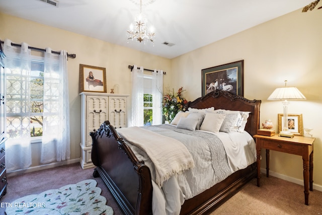 carpeted bedroom featuring a chandelier and multiple windows