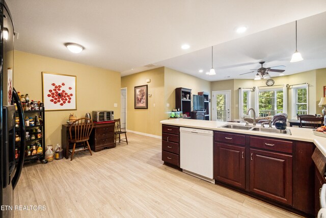 kitchen with ceiling fan, dishwasher, hanging light fixtures, and sink