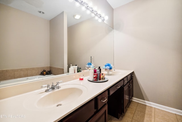 bathroom featuring a bath, vanity, and tile patterned floors