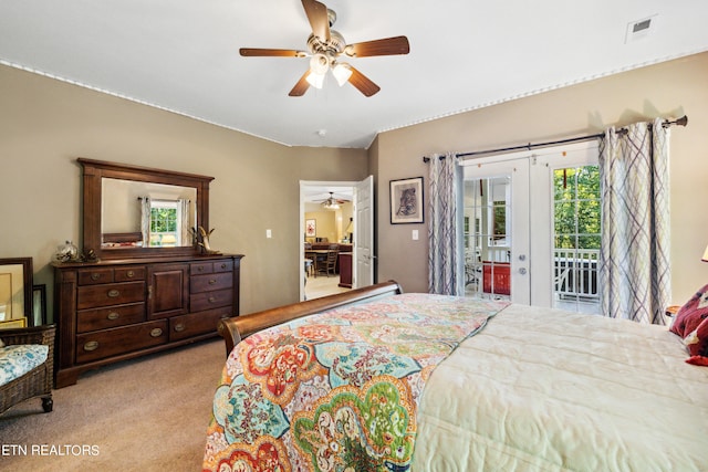 carpeted bedroom with ceiling fan and access to exterior