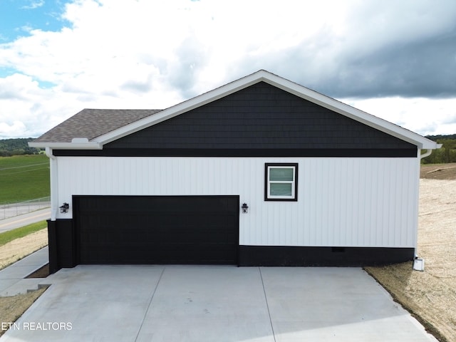 view of property exterior with a garage