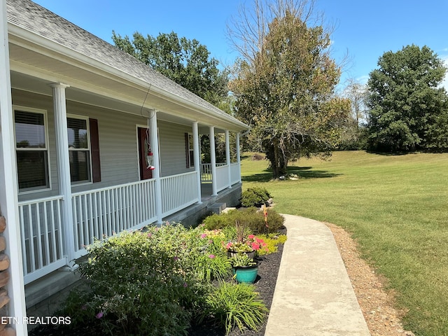 view of yard with covered porch