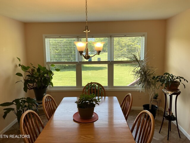 dining space with a notable chandelier and a wealth of natural light