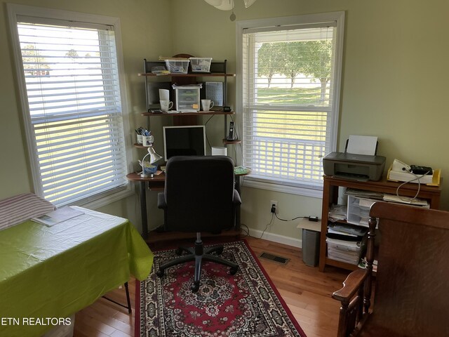 home office with light wood-type flooring