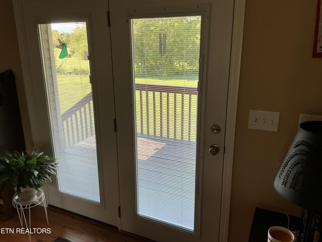 doorway to outside with hardwood / wood-style floors