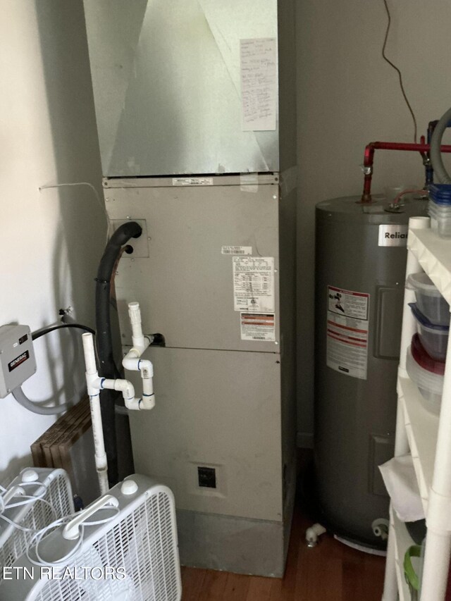 utility room featuring water heater