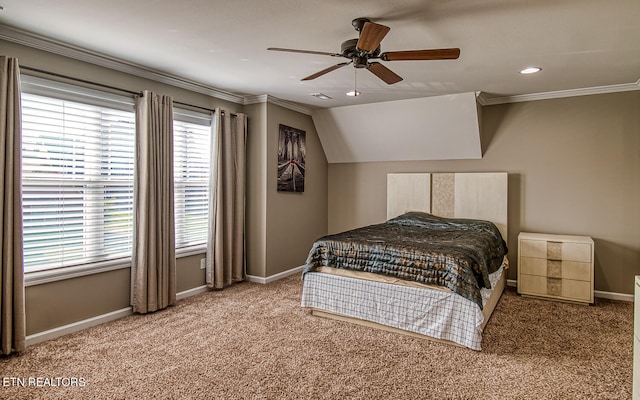 bedroom with carpet floors, ceiling fan, crown molding, and lofted ceiling