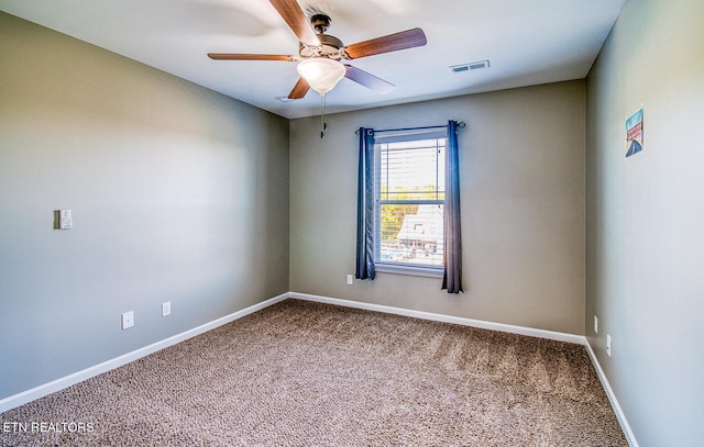 unfurnished room with carpet and ceiling fan