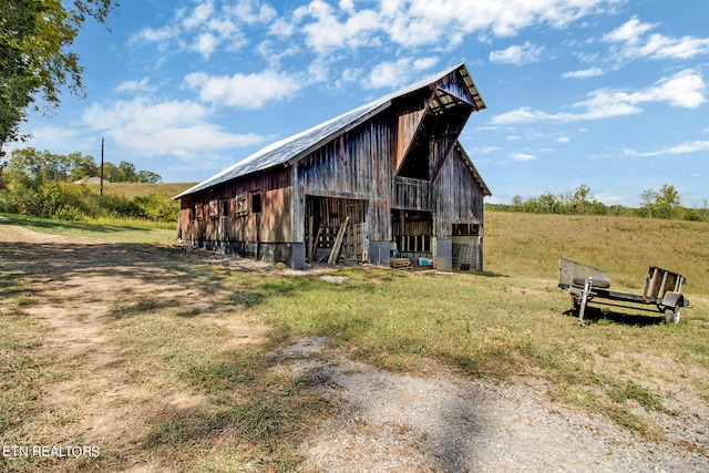 view of outbuilding featuring a rural view