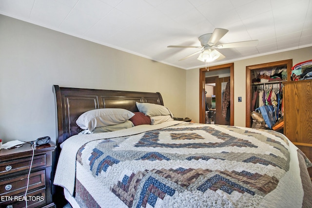 bedroom with ceiling fan, a closet, and crown molding