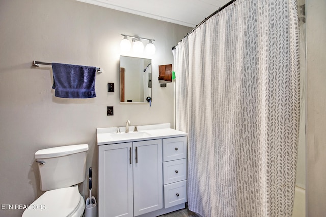 full bathroom with shower / tub combo with curtain, vanity, and toilet