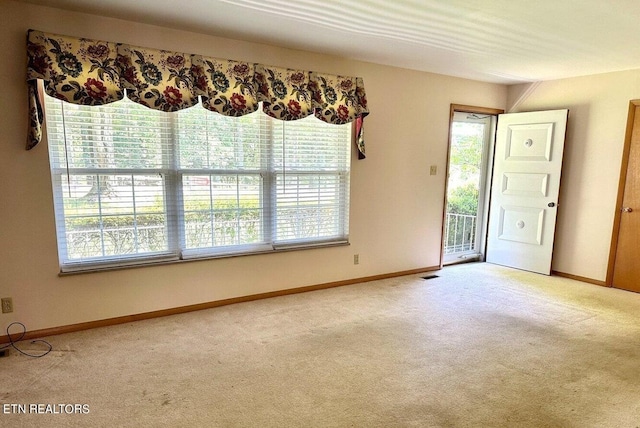 unfurnished room featuring carpet flooring