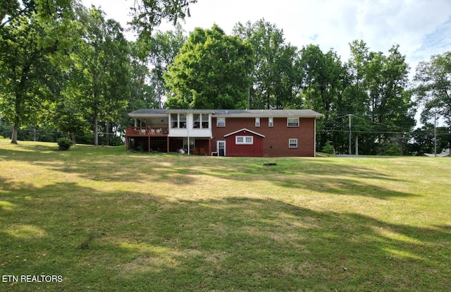 exterior space featuring a deck and a lawn