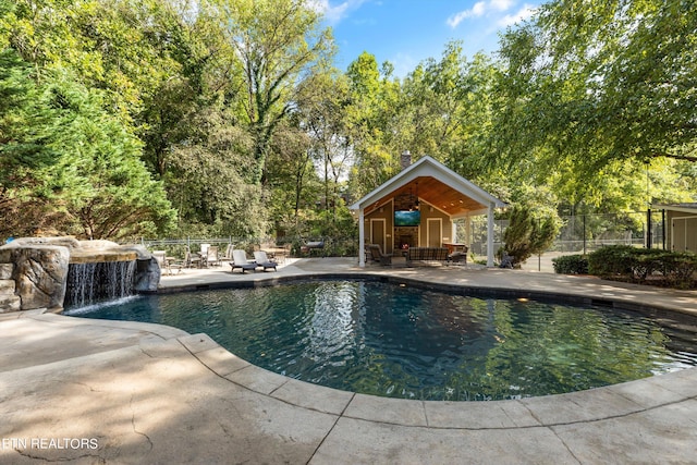 view of swimming pool featuring a patio and pool water feature