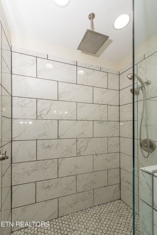 bathroom with tiled shower