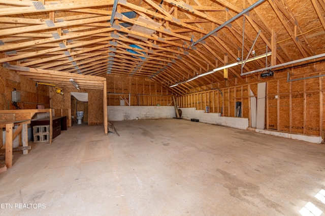 misc room with lofted ceiling