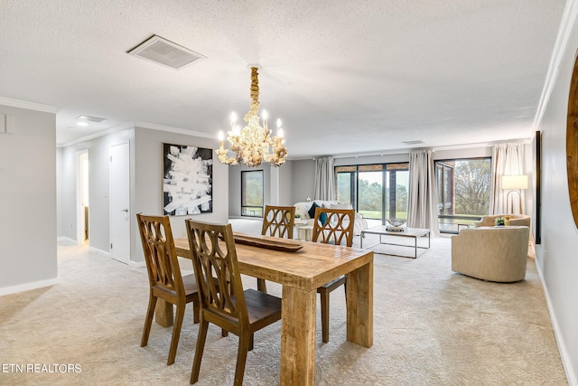 carpeted dining room featuring a textured ceiling, crown molding, and a notable chandelier