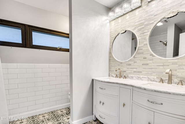 bathroom featuring tile patterned flooring and vanity