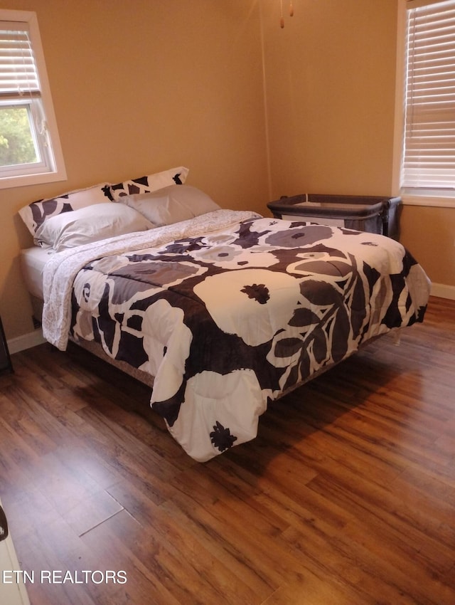 bedroom featuring dark hardwood / wood-style flooring