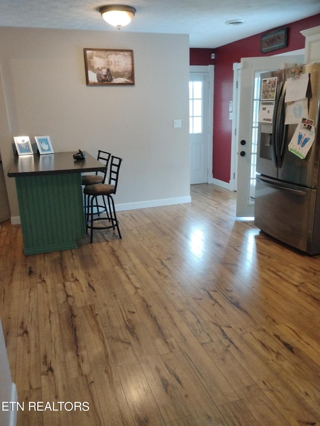 dining area with hardwood / wood-style floors