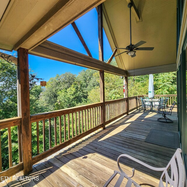 wooden terrace featuring ceiling fan