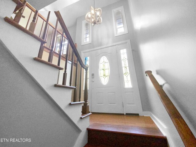 entrance foyer featuring a notable chandelier and a high ceiling