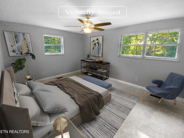 carpeted bedroom featuring ceiling fan