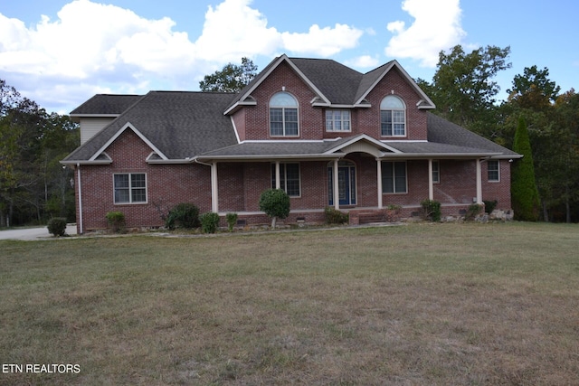 view of front of property featuring a porch and a front lawn