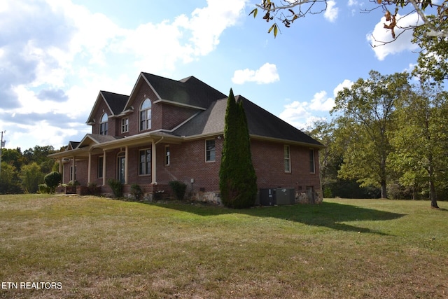 view of home's exterior featuring a lawn and central air condition unit