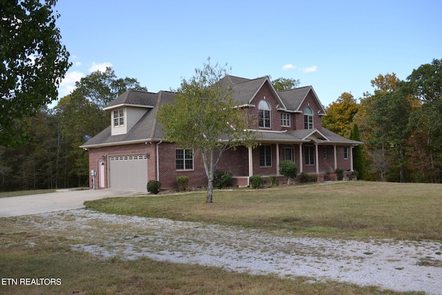 view of front facade with a front lawn and a garage