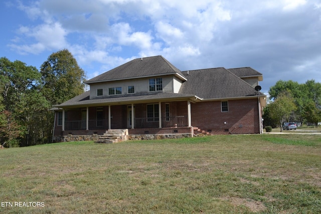 view of front of property featuring a front lawn and a porch