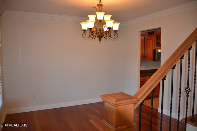 interior space featuring wood-type flooring, crown molding, and a chandelier