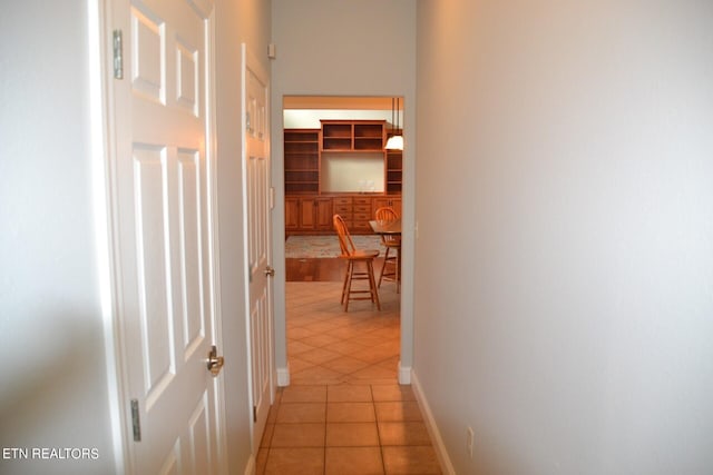 hallway featuring light tile patterned flooring