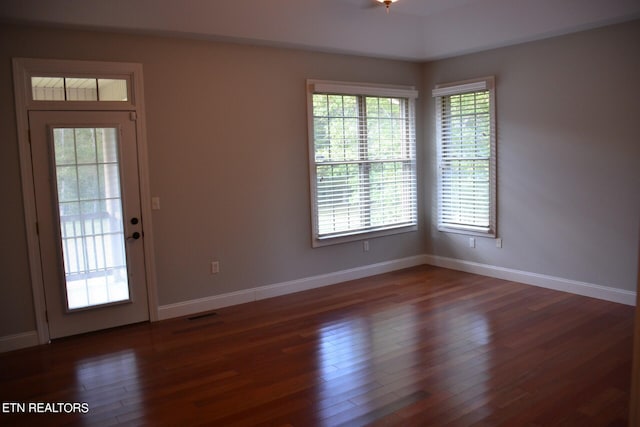 interior space with dark hardwood / wood-style flooring