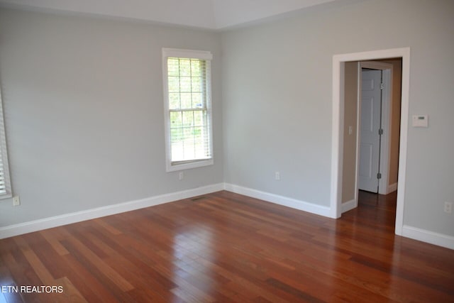 spare room featuring dark hardwood / wood-style flooring