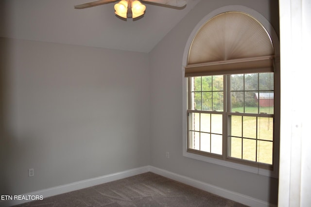 carpeted empty room with ceiling fan and vaulted ceiling