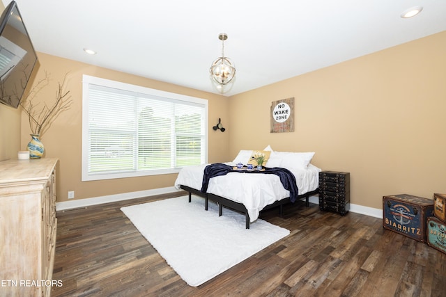 bedroom with dark wood-type flooring