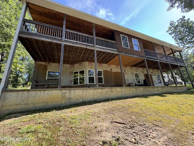 back of house with a balcony