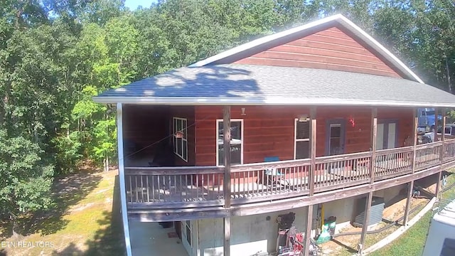 exterior space with a shingled roof