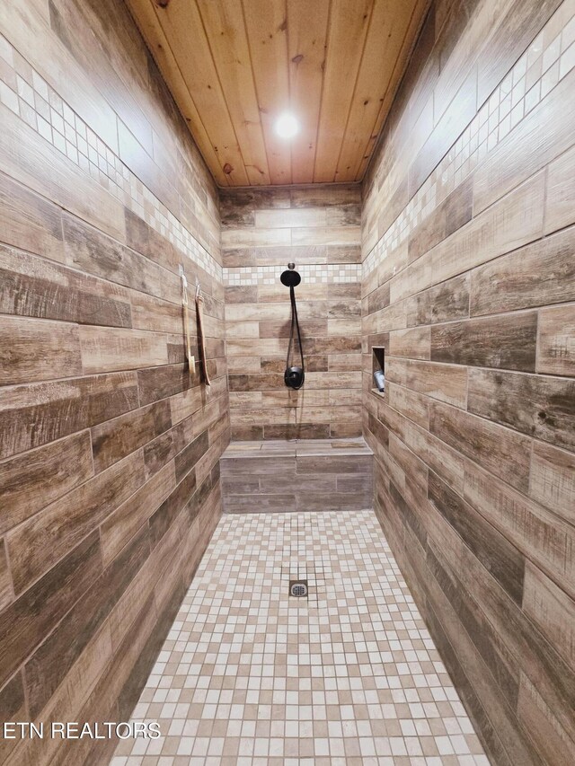 details with wood ceiling and wood walls