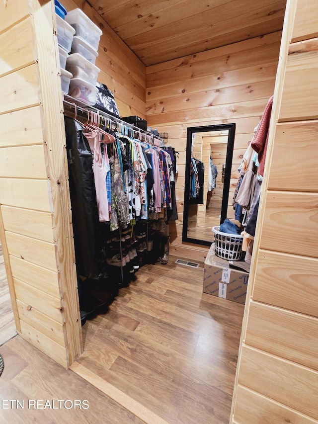 spacious closet with visible vents and wood finished floors