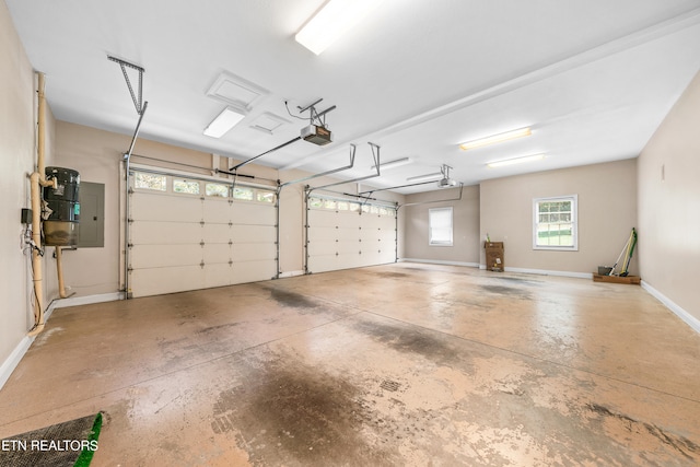 garage with electric panel and a garage door opener